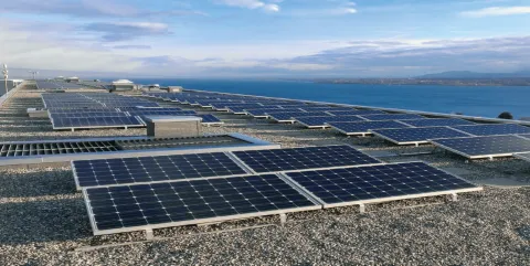 Solar panels with a view on Lake Geneva can be seen.