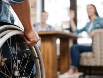 A picture of a person in a wheelchair is displayed.