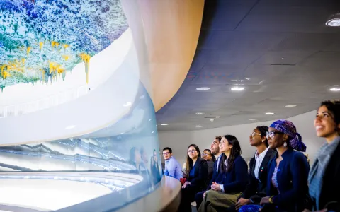 Visitors in the Palais des Nations' room XX.
